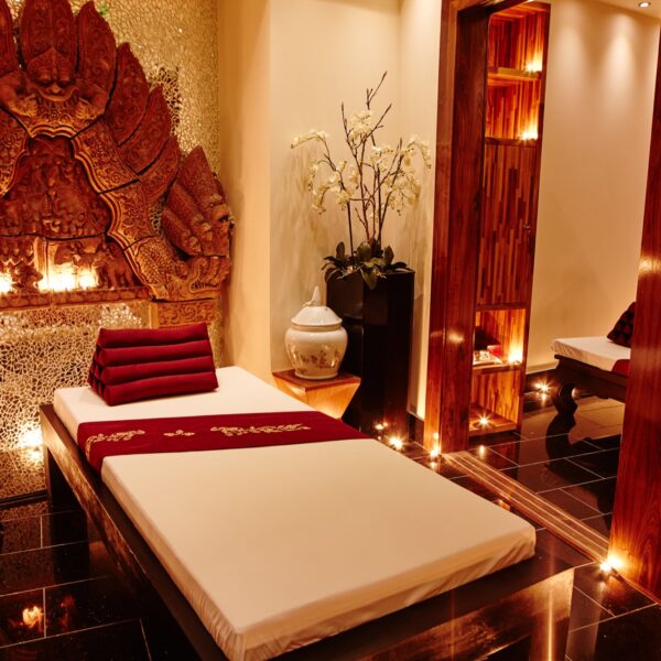 Thai Square Spa treatment room in London with warm lighting and luxurious setting for spring spa day